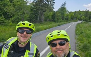 Cst Dunn and Cst Cleveland patroling parks and trails on E-bikes