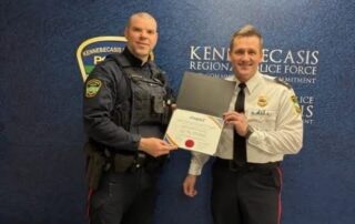 Cst. MacIntosh recieving the MADD Bronze Award from Chief Young