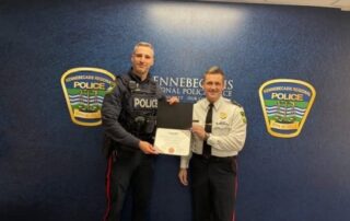 Cst. Parlee recieving MADD Bronze award for impaired driving from Chief Young